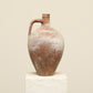 A one-of-a-kind clay brown Turkish vintage vase pot with a handle, crafted from terra cotta clay, this piece showcases timeless quality and antique craftsmanship, adding a unique touch of history to your space