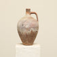 A one-of-a-kind clay brown Turkish vintage vase pot with a handle, crafted from terra cotta clay, this piece showcases timeless quality and antique craftsmanship, adding a unique touch of history to your space