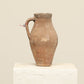 A one-of-a-kind clay brown Turkish vintage vase pot with a handle, crafted from terra cotta clay, this piece showcases timeless quality and antique craftsmanship, adding a unique touch of history to your space