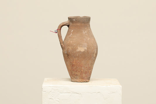 A one-of-a-kind clay brown Turkish vintage vase pot with a handle, crafted from terra cotta clay, this piece showcases timeless quality and antique craftsmanship, adding a unique touch of history to your space