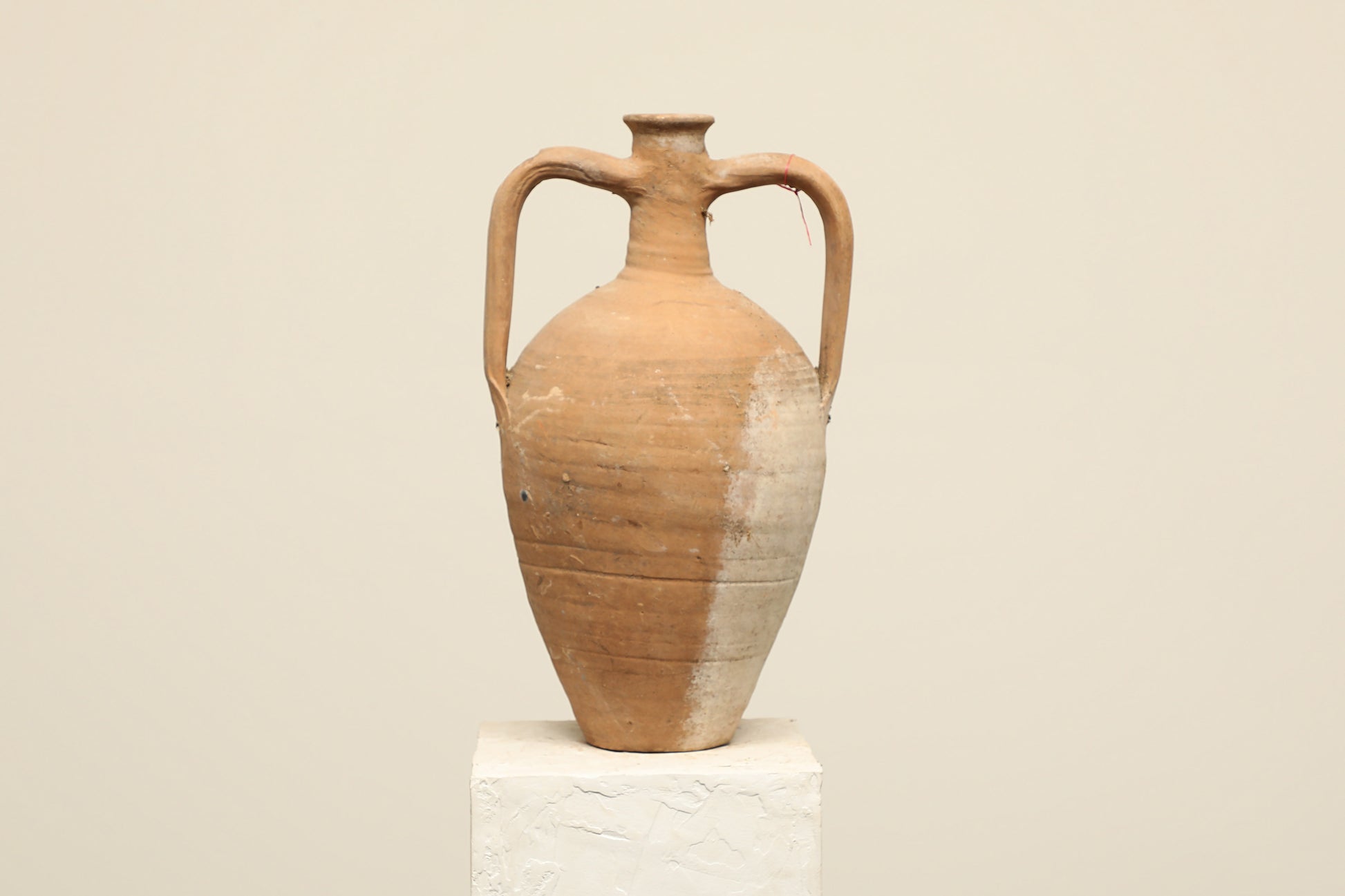 A one-of-a-kind clay brown Turkish vintage vase pot with two handles, crafted from terra cotta clay, this piece showcases timeless quality and antique craftsmanship, adding a unique touch of history to your space