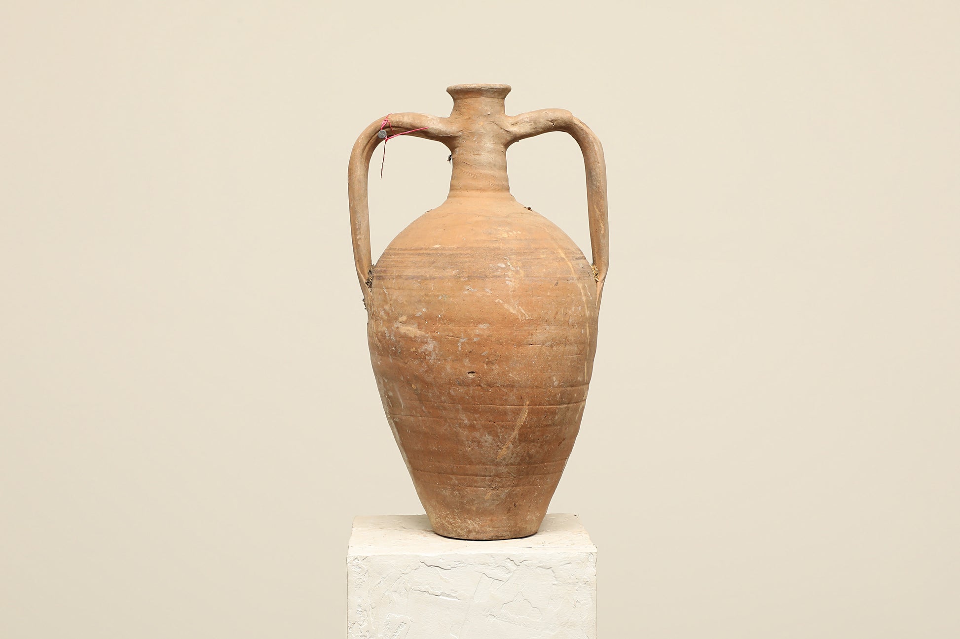 A one-of-a-kind clay brown Turkish vintage vase pot with two handles, crafted from terra cotta clay, this piece showcases timeless quality and antique craftsmanship, adding a unique touch of history to your space