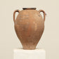 A one-of-a-kind clay brown Turkish vintage vase pot with two handles, crafted from terra cotta clay, this piece showcases timeless quality and antique craftsmanship, adding a unique touch of history to your space