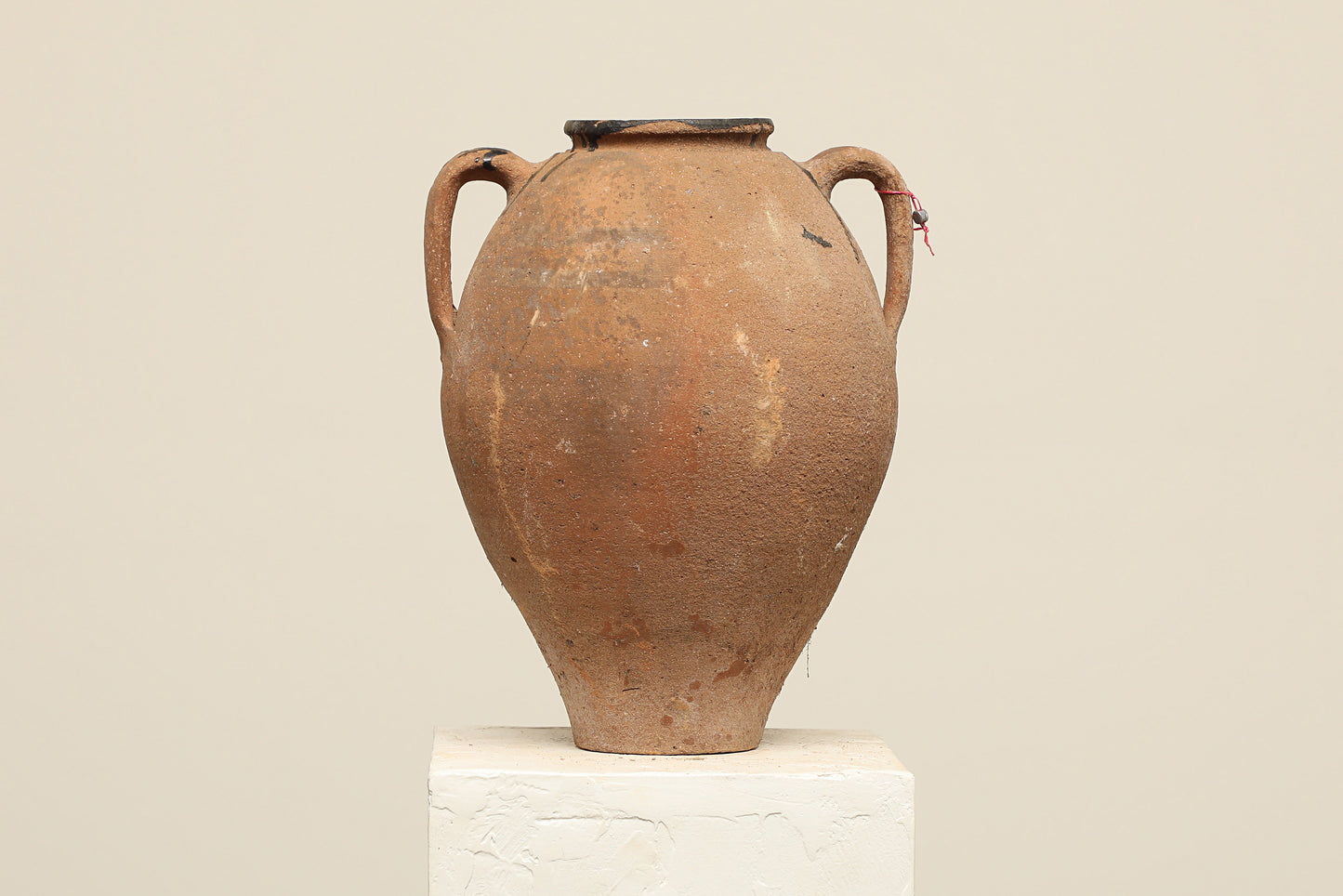A one-of-a-kind clay brown Turkish vintage vase pot with two handles, crafted from terra cotta clay, this piece showcases timeless quality and antique craftsmanship, adding a unique touch of history to your space