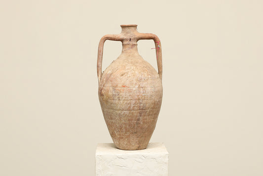 A one-of-a-kind clay brown Turkish vintage vase pot with two handles, crafted from terra cotta clay, this piece showcases timeless quality and antique craftsmanship, adding a unique touch of history to your space