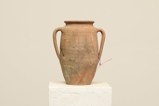 A one-of-a-kind clay brown Turkish vintage vase pot with two handles, crafted from terra cotta clay, this piece showcases timeless quality and antique craftsmanship, adding a unique touch of history to your space