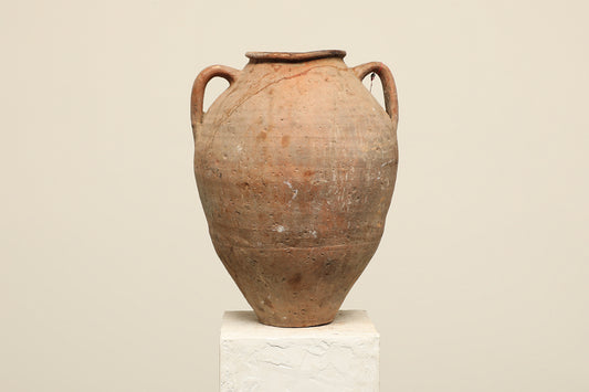 A one-of-a-kind clay brown Turkish vintage vase pot with two handles, crafted from terra cotta clay, this piece showcases timeless quality and antique craftsmanship, adding a unique touch of history to your space