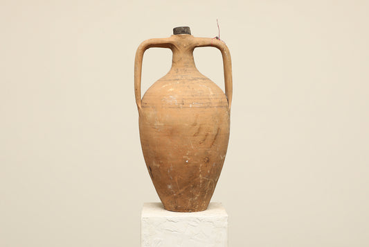 A one-of-a-kind clay brown Turkish vintage vase pot with two handles, crafted from terra cotta clay, this piece showcases timeless quality and antique craftsmanship, adding a unique touch of history to your space