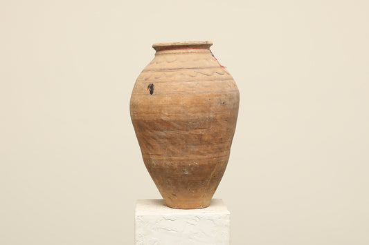 A one-of-a-kind clay brown Turkish vintage vase pot without a handle, crafted from terra cotta clay, this piece showcases timeless quality and antique craftsmanship, adding a unique touch of history to your space