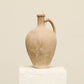 A one-of-a-kind cream Turkish vintage vase pot with a handle, crafted from terra cotta clay, this piece showcases timeless quality and antique craftsmanship, adding a unique touch of history to your space