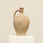 A one-of-a-kind cream Turkish vintage vase pot with a handle, crafted from terra cotta clay, this piece showcases timeless quality and antique craftsmanship, adding a unique touch of history to your space