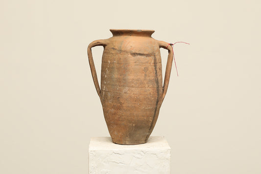 A one-of-a-kind dark brown Turkish vintage vase pot with two handles, crafted from terra cotta clay, this piece showcases timeless quality and antique craftsmanship, adding a unique touch of history to your space
