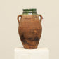 A one-of-a-kind dark brown Turkish vintage vase pot with two handles, crafted from terra cotta clay, this piece showcases timeless quality and antique craftsmanship, adding a unique touch of history to your space