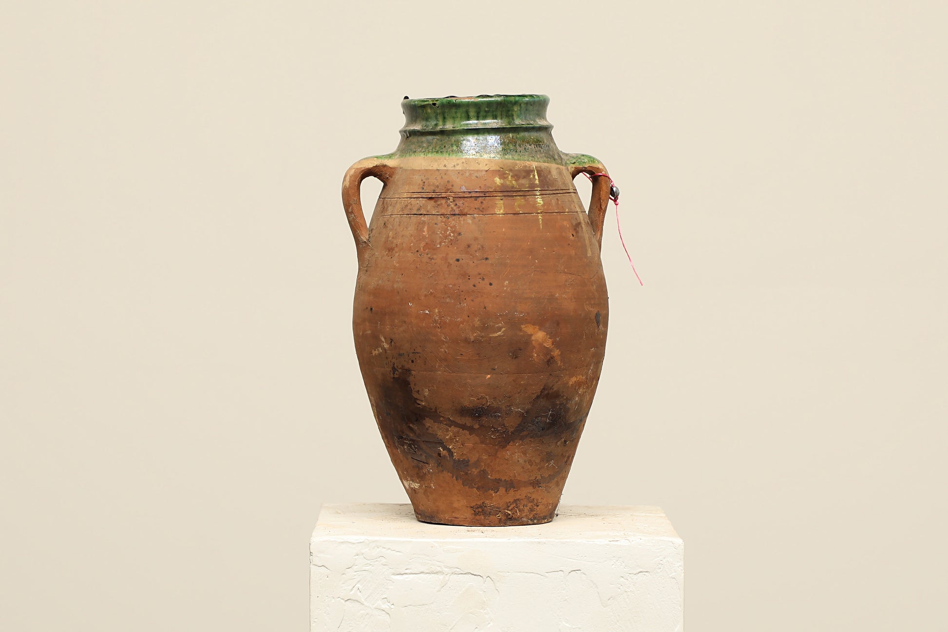 A one-of-a-kind dark brown Turkish vintage vase pot with two handles, crafted from terra cotta clay, this piece showcases timeless quality and antique craftsmanship, adding a unique touch of history to your space