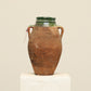 A one-of-a-kind dark brown Turkish vintage vase pot with two handles, crafted from terra cotta clay, this piece showcases timeless quality and antique craftsmanship, adding a unique touch of history to your space