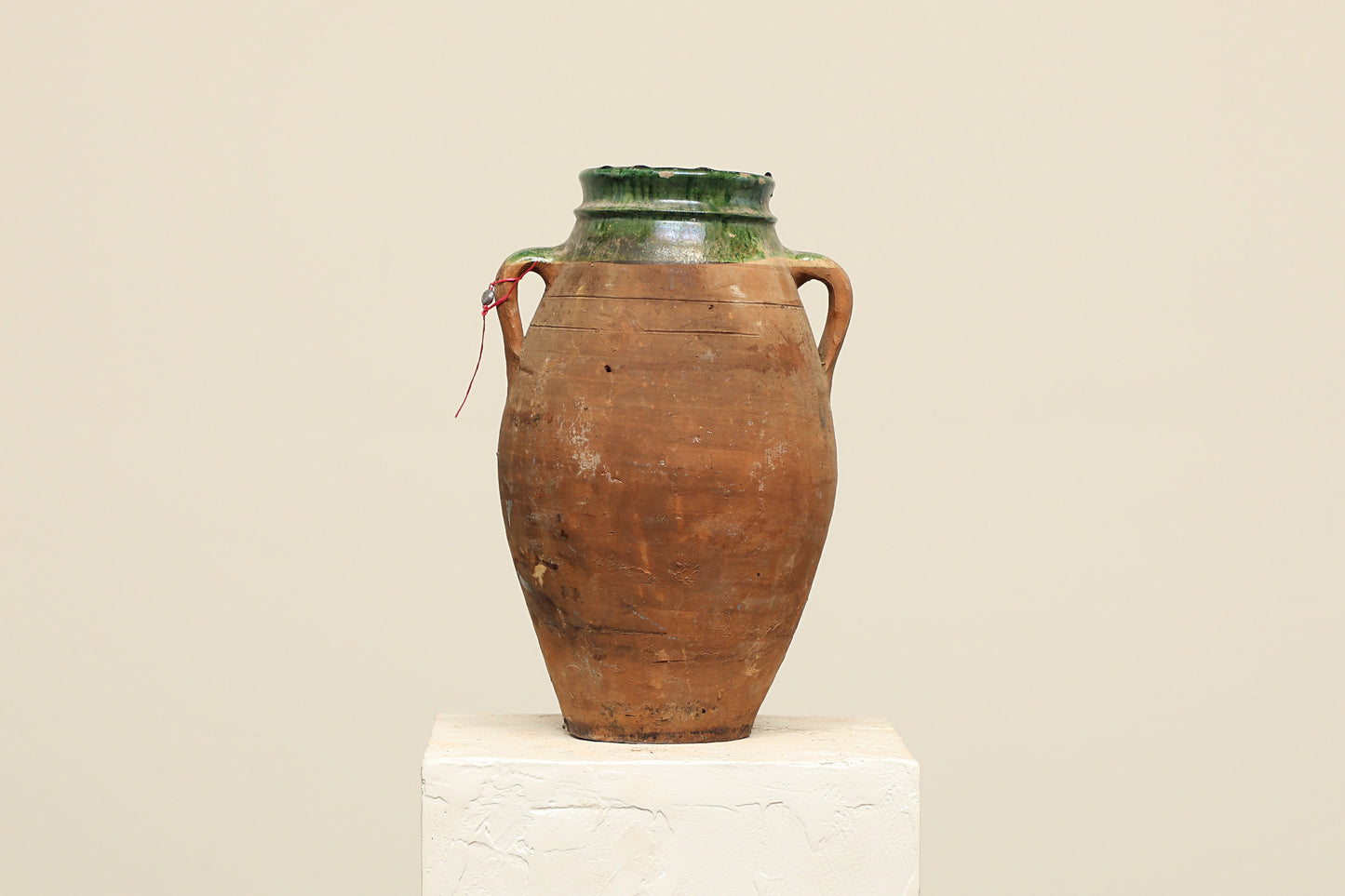 A one-of-a-kind dark brown Turkish vintage vase pot with two handles, crafted from terra cotta clay, this piece showcases timeless quality and antique craftsmanship, adding a unique touch of history to your space
