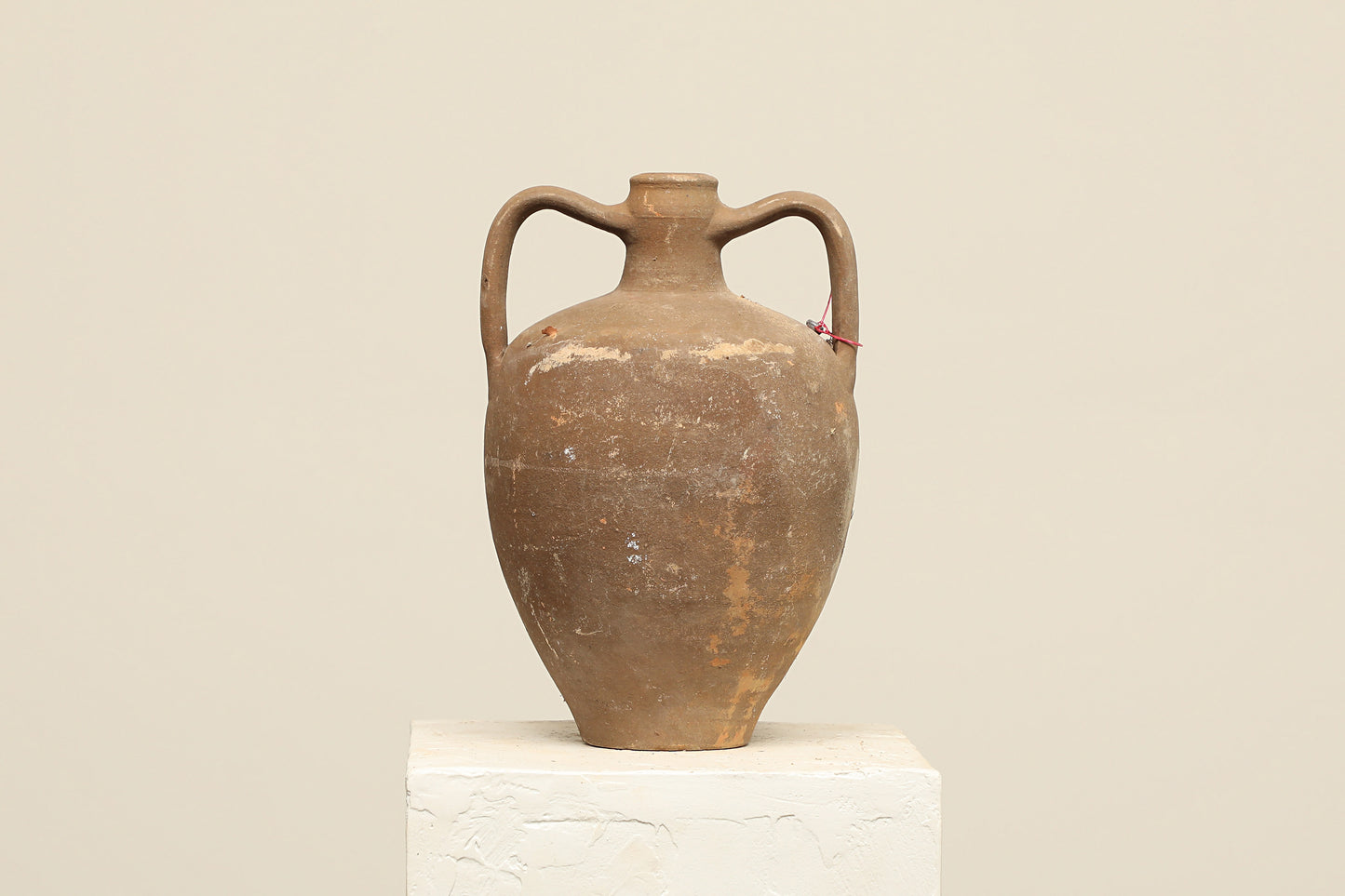 A one-of-a-kind dark brown Turkish vintage vase pot with two handles, crafted from terra cotta clay, this piece showcases timeless quality and antique craftsmanship, adding a unique touch of history to your space