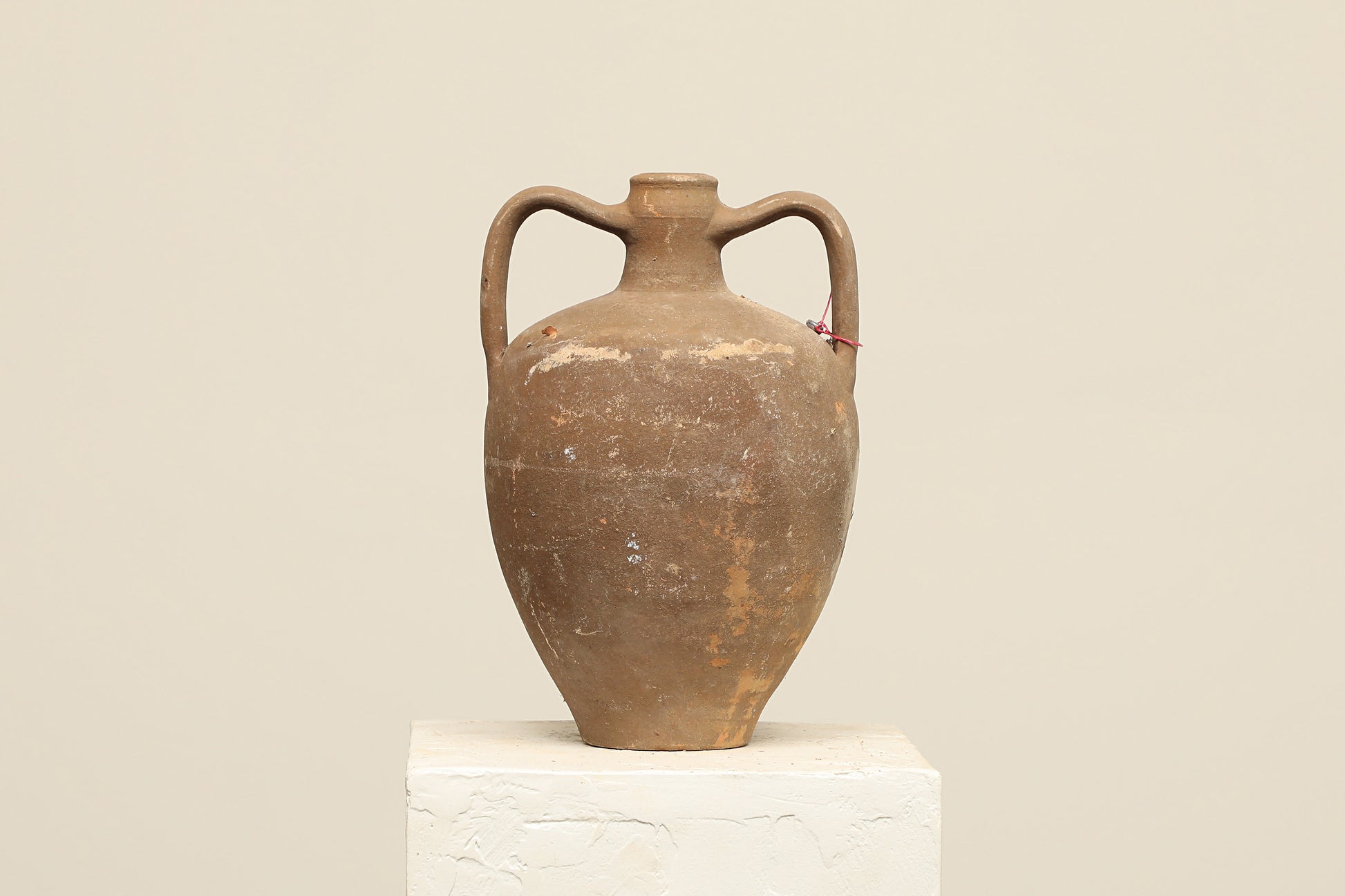A one-of-a-kind dark brown Turkish vintage vase pot with two handles, crafted from terra cotta clay, this piece showcases timeless quality and antique craftsmanship, adding a unique touch of history to your space