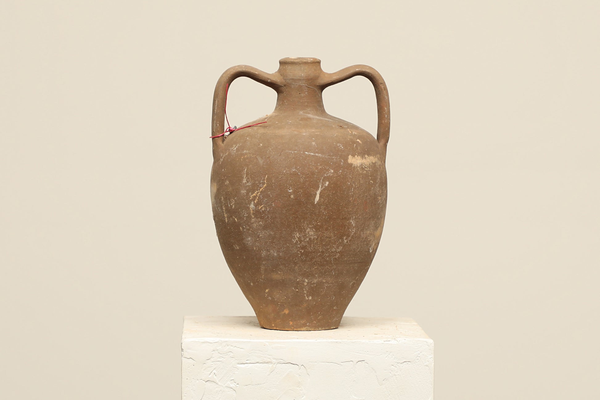 A one-of-a-kind dark brown Turkish vintage vase pot with two handles, crafted from terra cotta clay, this piece showcases timeless quality and antique craftsmanship, adding a unique touch of history to your space