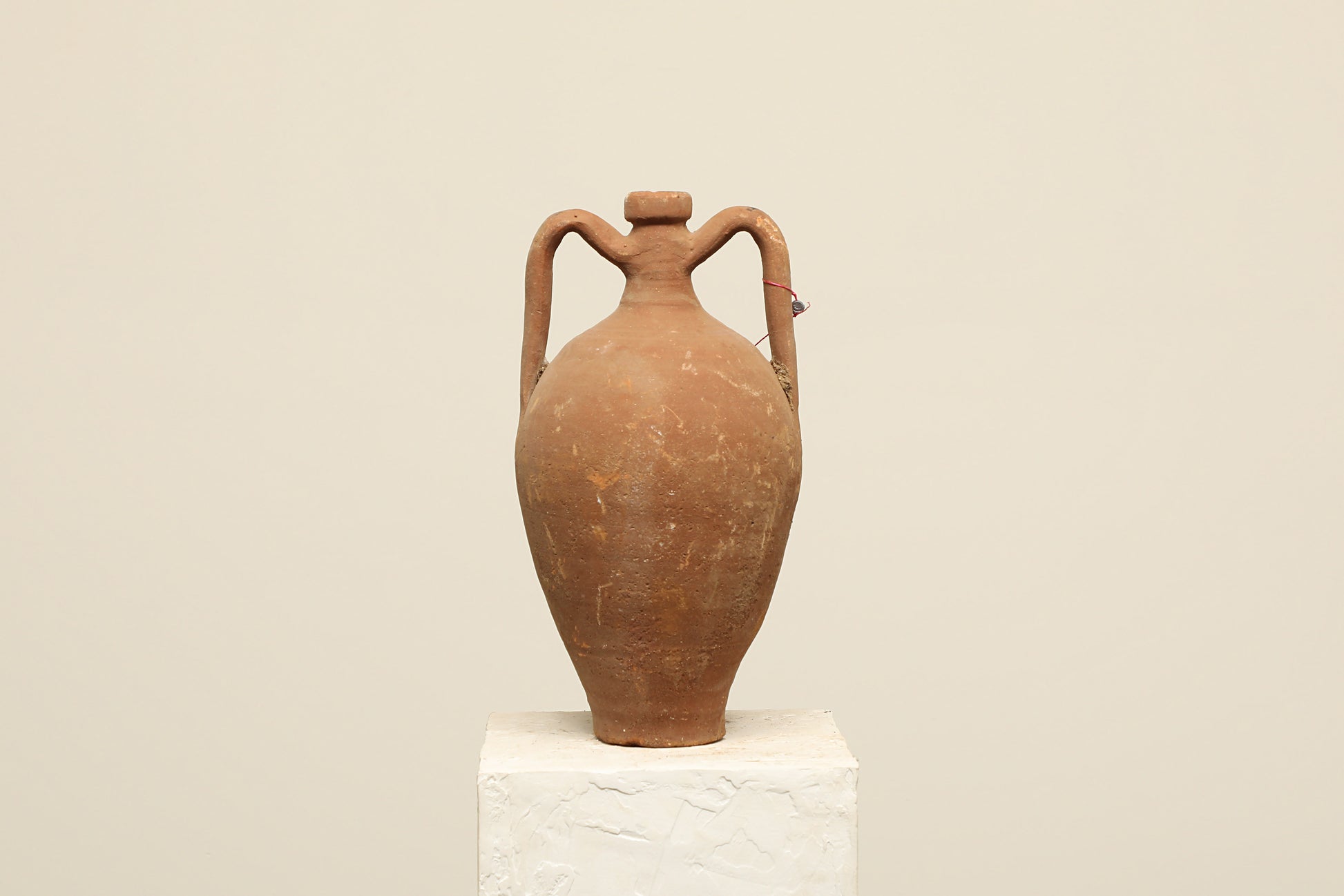 A one-of-a-kind dark brown Turkish vintage vase pot with two handles, crafted from terra cotta clay, this piece showcases timeless quality and antique craftsmanship, adding a unique touch of history to your space
