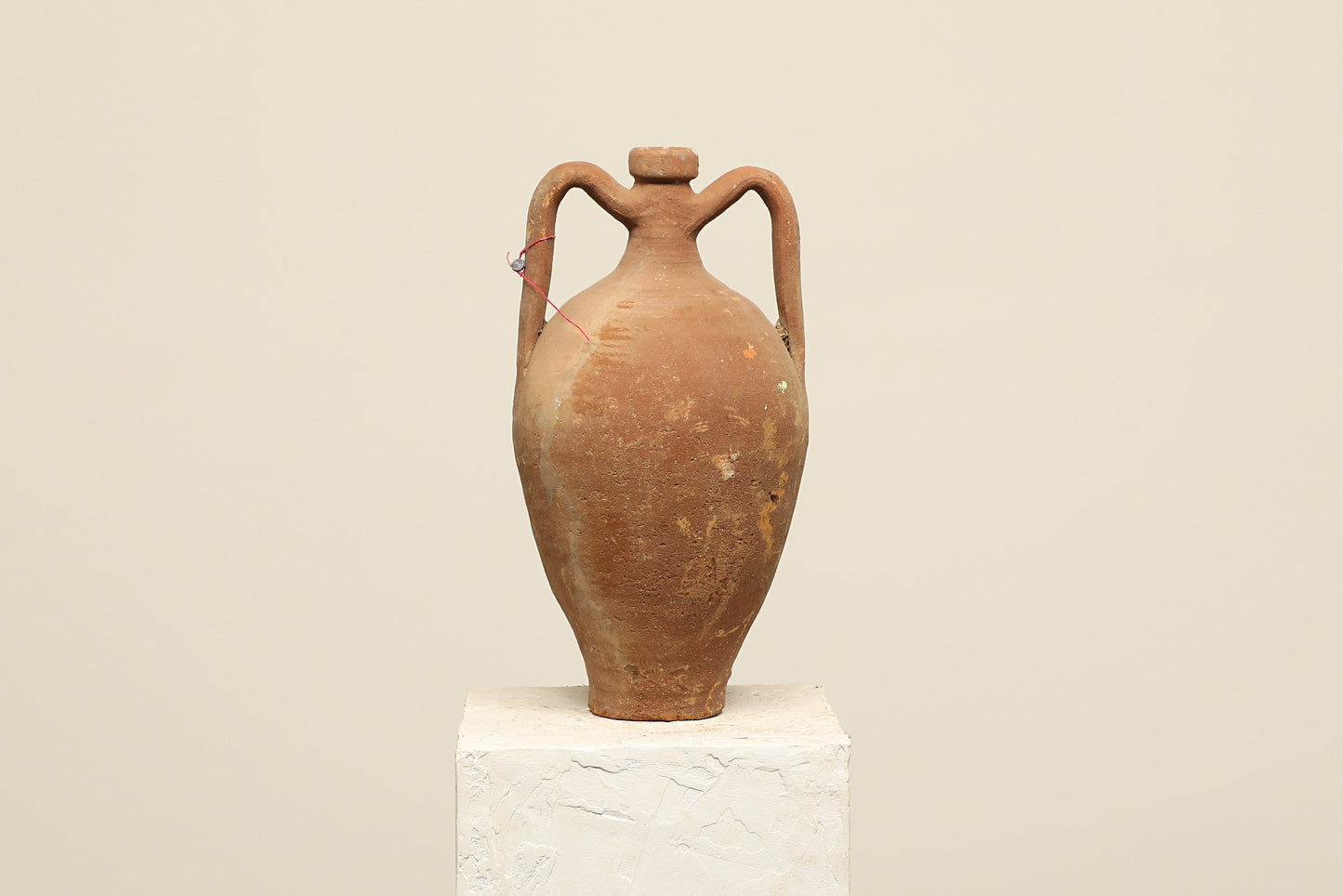 A one-of-a-kind dark brown Turkish vintage vase pot with two handles, crafted from terra cotta clay, this piece showcases timeless quality and antique craftsmanship, adding a unique touch of history to your space
