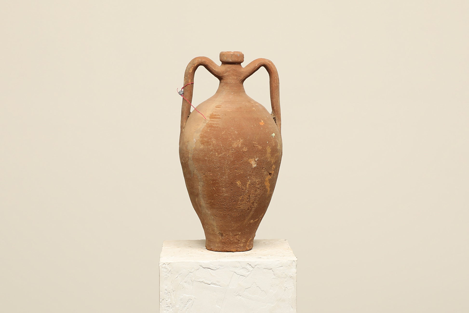 A one-of-a-kind dark brown Turkish vintage vase pot with two handles, crafted from terra cotta clay, this piece showcases timeless quality and antique craftsmanship, adding a unique touch of history to your space