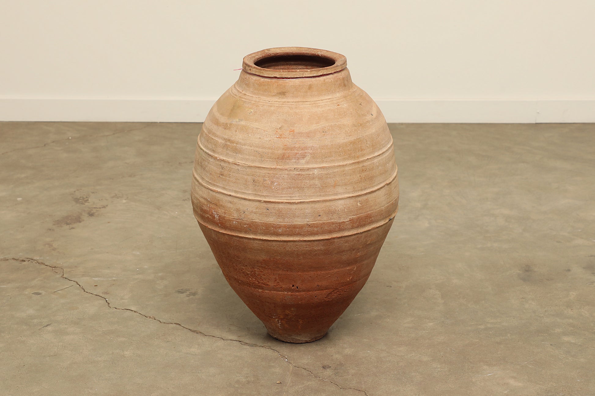 A one-of-a-kind dark brown Turkish vintage vase pot without a handle, crafted from terra cotta clay, this piece showcases timeless quality and antique craftsmanship, adding a unique touch of history to your space
