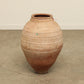 A one-of-a-kind dark brown Turkish vintage vase pot without a handle, crafted from terra cotta clay, this piece showcases timeless quality and antique craftsmanship, adding a unique touch of history to your space