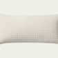 This clean ivory modern throw pillow features a stitched grid design for a hint of texture. The accent pillow cover is made of cotton and measures 12-inches by 27-inches, an elongated size to style in living rooms and bedrooms.