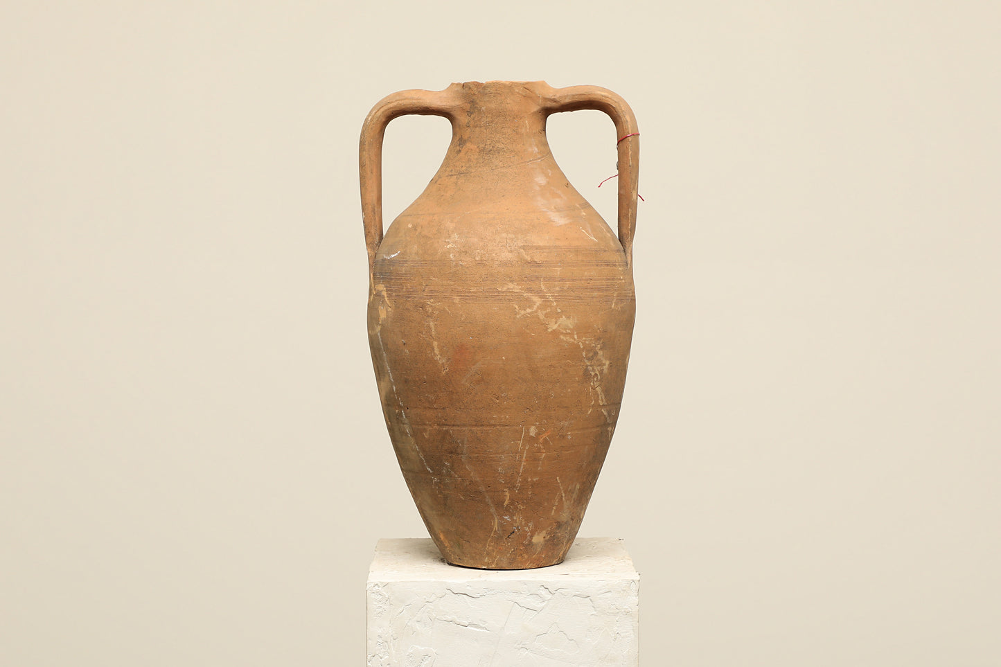 A one-of-a-kind rustic red Turkish vintage vase pot with two handles, crafted from terra cotta clay, this piece showcases timeless quality and antique craftsmanship, adding a unique touch of history to your space