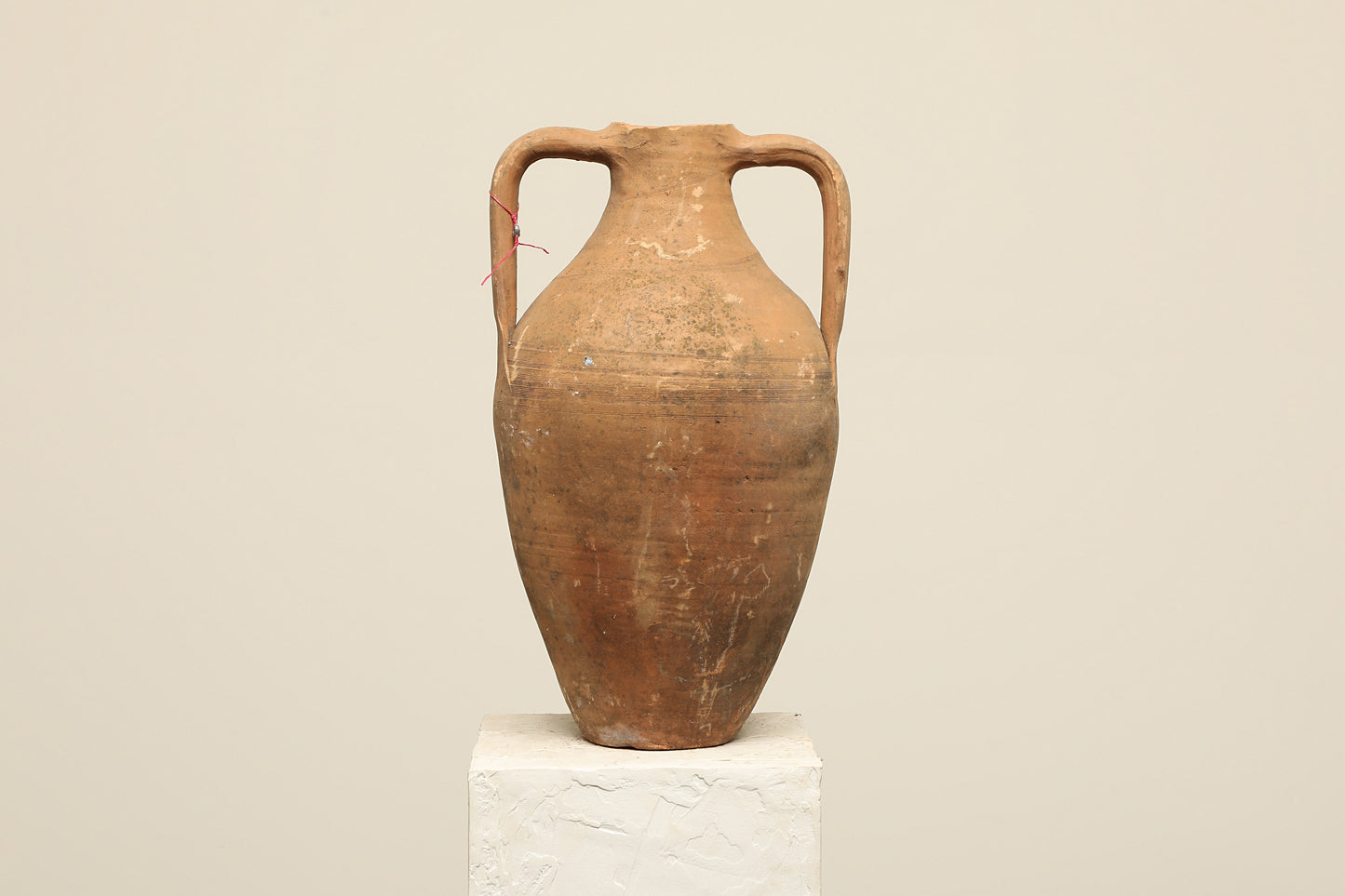 A one-of-a-kind rustic red Turkish vintage vase pot with two handles, crafted from terra cotta clay, this piece showcases timeless quality and antique craftsmanship, adding a unique touch of history to your space