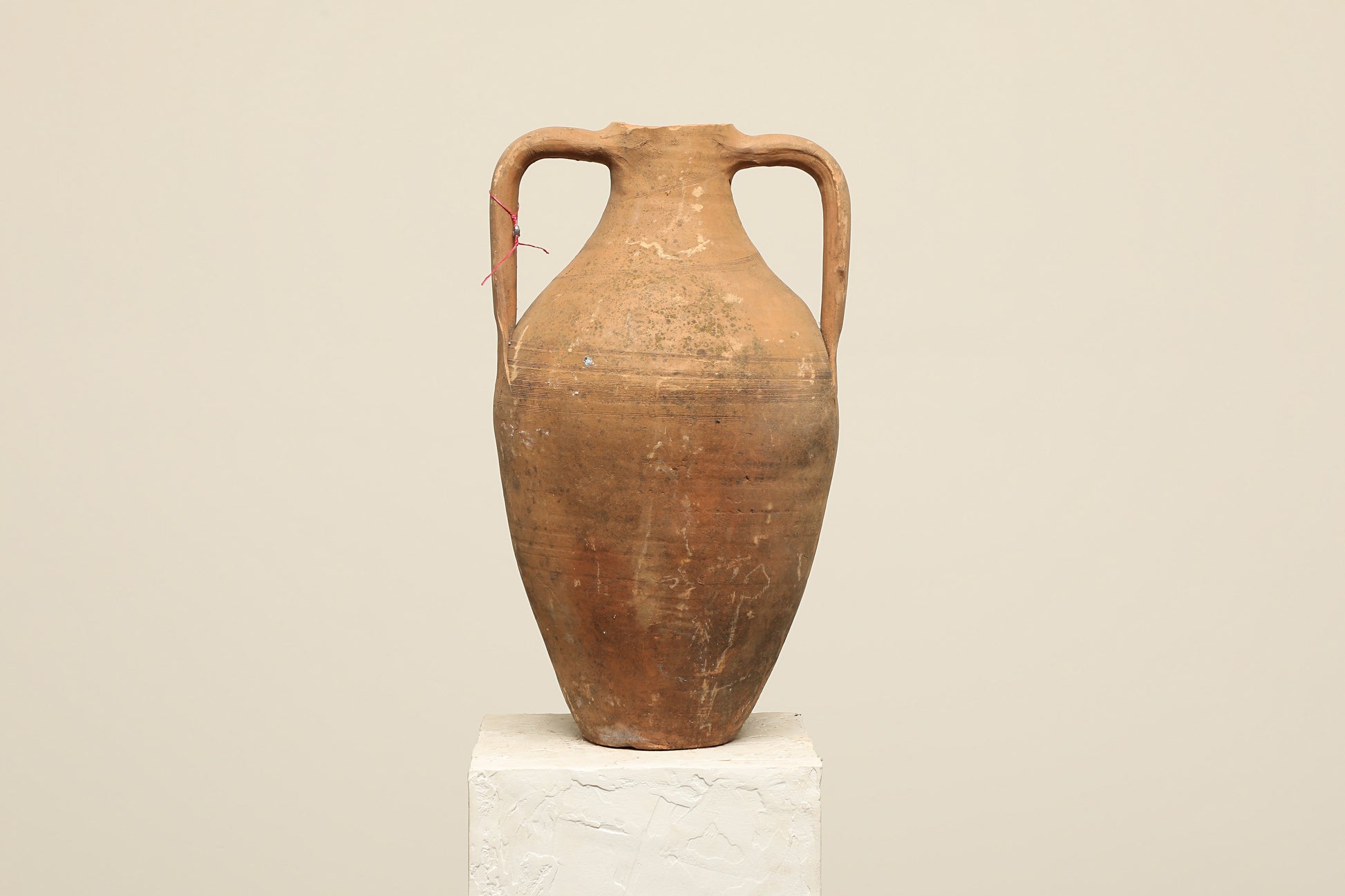 A one-of-a-kind rustic red Turkish vintage vase pot with two handles, crafted from terra cotta clay, this piece showcases timeless quality and antique craftsmanship, adding a unique touch of history to your space