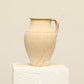 A one-of-a-kind natural Turkish vintage vase pot with a handle, crafted from terra cotta clay, this piece showcases timeless quality and antique craftsmanship, adding a unique touch of history to your space