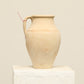 A one-of-a-kind natural Turkish vintage vase pot with a handle, crafted from terra cotta clay, this piece showcases timeless quality and antique craftsmanship, adding a unique touch of history to your space