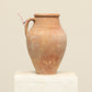A one-of-a-kind natural Turkish vintage vase pot with a handle, crafted from terra cotta clay, this piece showcases timeless quality and antique craftsmanship, adding a unique touch of history to your space