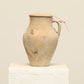 A one-of-a-kind natural Turkish vintage vase pot with a handle, crafted from terra cotta clay, this piece showcases timeless quality and antique craftsmanship, adding a unique touch of history to your space