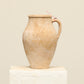 A one-of-a-kind natural Turkish vintage vase pot with a handle, crafted from terra cotta clay, this piece showcases timeless quality and antique craftsmanship, adding a unique touch of history to your space