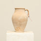 A one-of-a-kind natural Turkish vintage vase pot with a handle, crafted from terra cotta clay, this piece showcases timeless quality and antique craftsmanship, adding a unique touch of history to your space