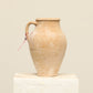 A one-of-a-kind natural Turkish vintage vase pot with a handle, crafted from terra cotta clay, this piece showcases timeless quality and antique craftsmanship, adding a unique touch of history to your space