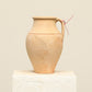 A one-of-a-kind natural Turkish vintage vase pot with a handle, crafted from terra cotta clay, this piece showcases timeless quality and antique craftsmanship, adding a unique touch of history to your space