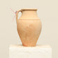 A one-of-a-kind natural Turkish vintage vase pot with a handle, crafted from terra cotta clay, this piece showcases timeless quality and antique craftsmanship, adding a unique touch of history to your space