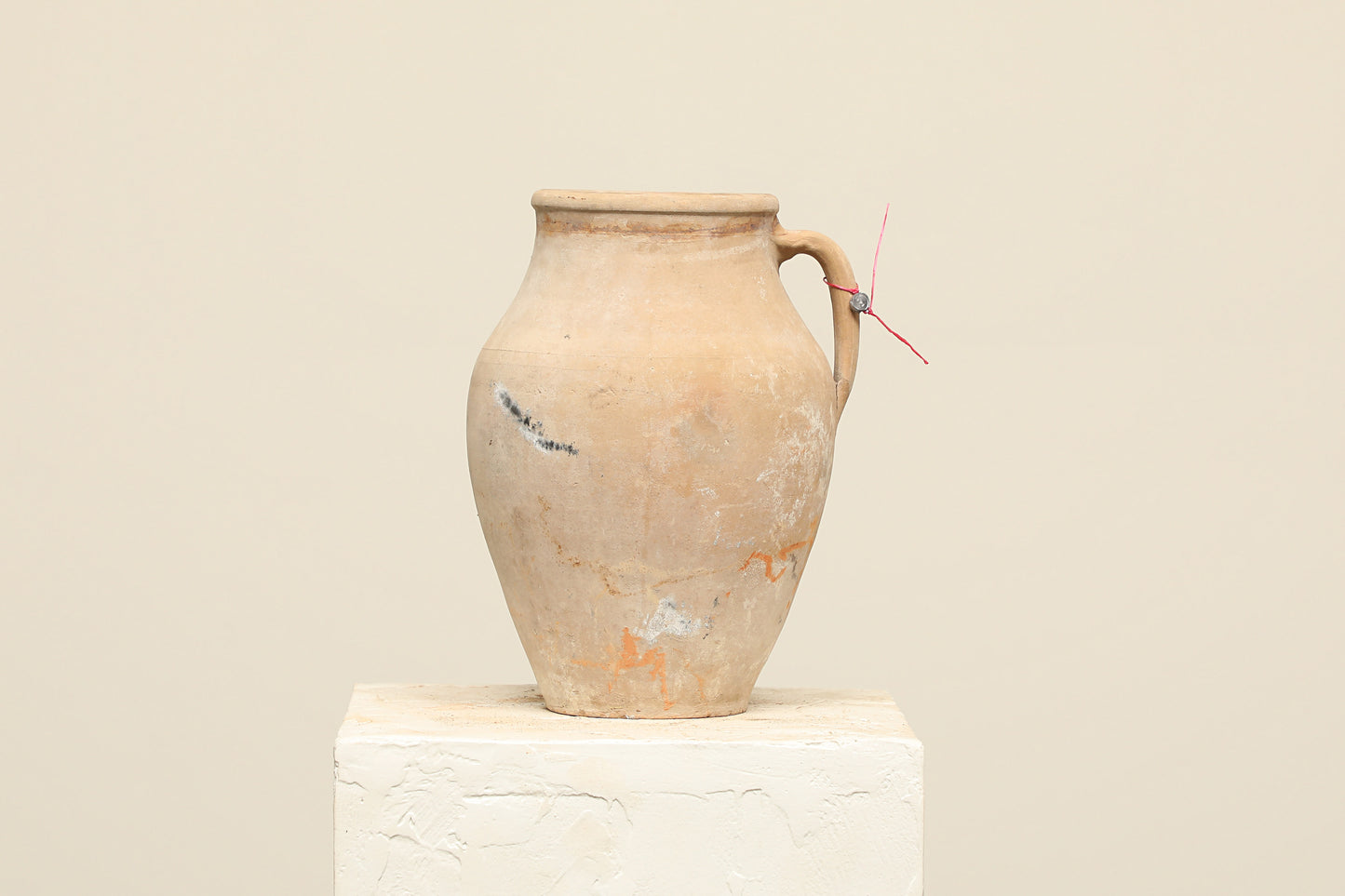 A one-of-a-kind natural Turkish vintage vase pot with a handle, crafted from terra cotta clay, this piece showcases timeless quality and antique craftsmanship, adding a unique touch of history to your space