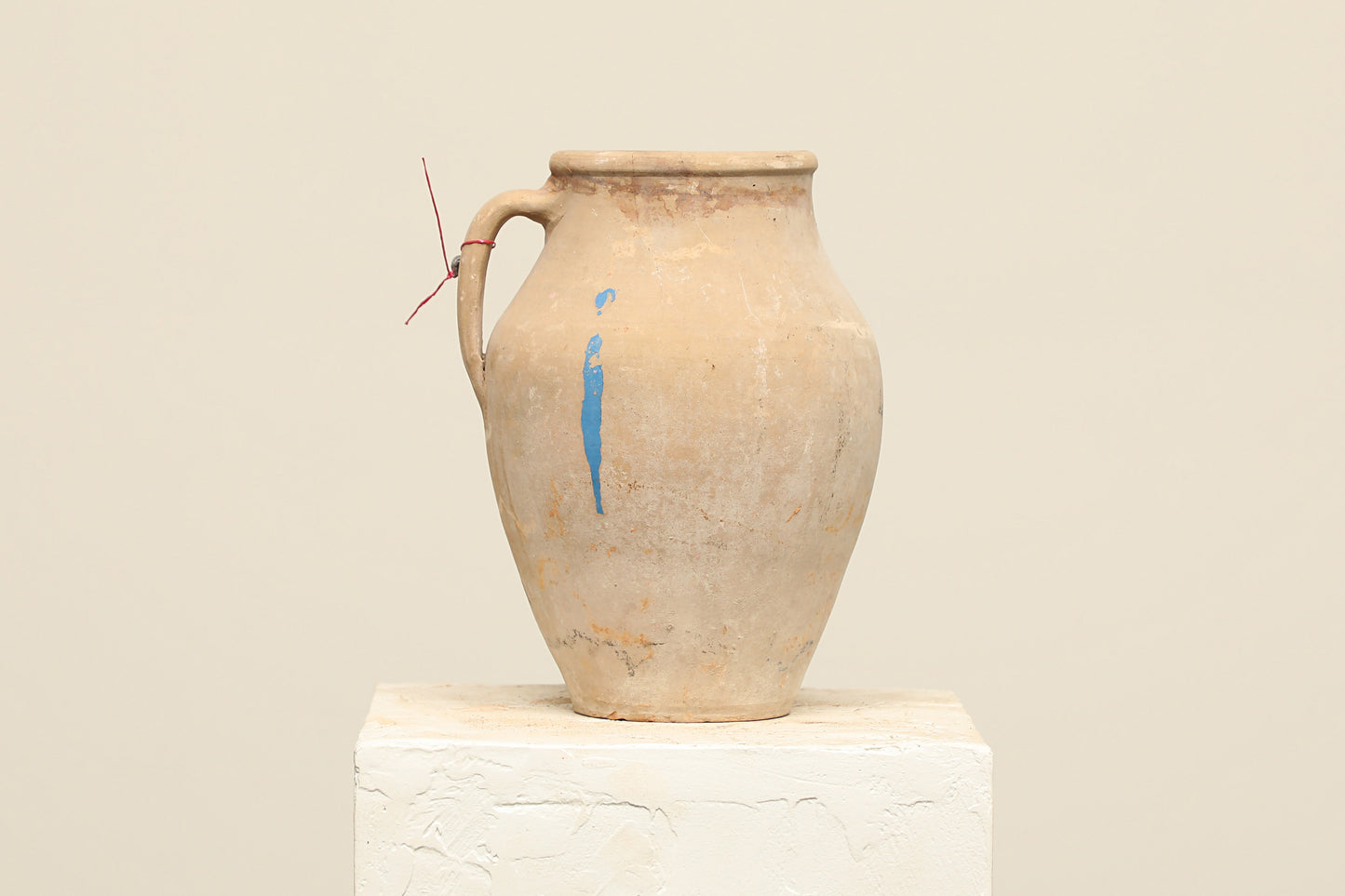 A one-of-a-kind natural Turkish vintage vase pot with a handle, crafted from terra cotta clay, this piece showcases timeless quality and antique craftsmanship, adding a unique touch of history to your space