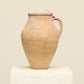 A one-of-a-kind natural Turkish vintage vase pot with a handle, crafted from terra cotta clay, this piece showcases timeless quality and antique craftsmanship, adding a unique touch of history to your space