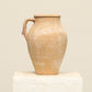A one-of-a-kind natural Turkish vintage vase pot with a handle, crafted from terra cotta clay, this piece showcases timeless quality and antique craftsmanship, adding a unique touch of history to your space