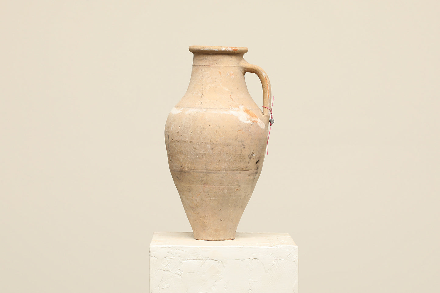 A one-of-a-kind natural Turkish vintage vase pot with a handle, crafted from terra cotta clay, this piece showcases timeless quality and antique craftsmanship, adding a unique touch of history to your space