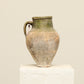 A one-of-a-kind natural Turkish vintage vase pot with a handle, crafted from terra cotta clay, this piece showcases timeless quality and antique craftsmanship, adding a unique touch of history to your space