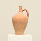A one-of-a-kind natural Turkish vintage vase pot with a handle, crafted from terra cotta clay, this piece showcases timeless quality and antique craftsmanship, adding a unique touch of history to your space