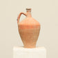 A one-of-a-kind natural Turkish vintage vase pot with a handle, crafted from terra cotta clay, this piece showcases timeless quality and antique craftsmanship, adding a unique touch of history to your space