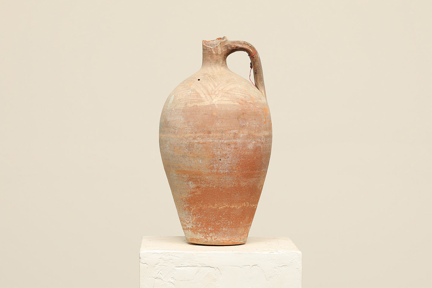 A one-of-a-kind natural Turkish vintage vase pot with a handle, crafted from terra cotta clay, this piece showcases timeless quality and antique craftsmanship, adding a unique touch of history to your space